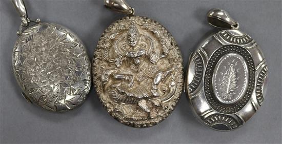 Two Victorian engraved silver lockets and an ornate Indian white metal locket, largest 50mm.